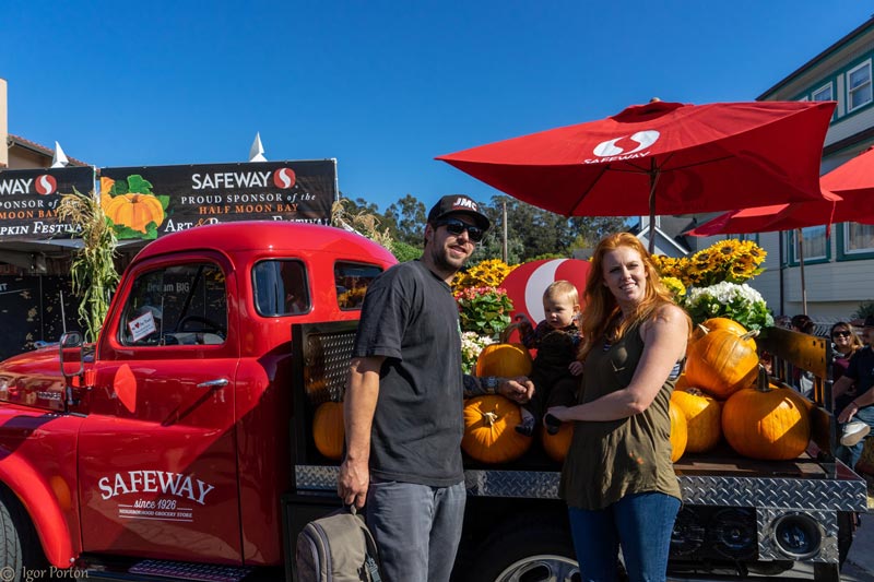 family posing at the Safeway display with vintage pickup